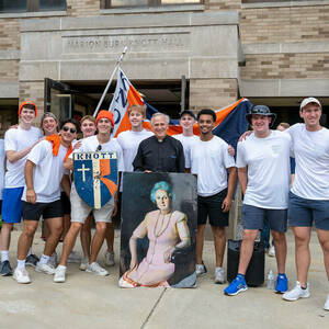 President Rev. John I. Jenkins, C.S.C. with Knott Hall residents who helped incoming first year students with move in 2022