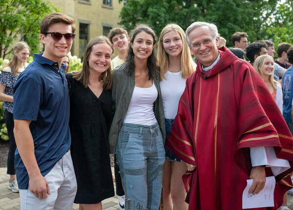 President Rev. John I. Jenkins, C.S.C. greets students before Opening Mass outside of the Basilica of the Sacred Heart