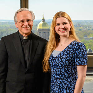 Fr. John Jenkins and a student smile at the camera