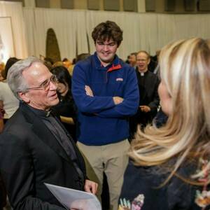 Fr. Jenkins visits with a student and his mother during Junior Parents Weekend