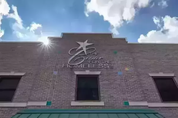 The front entrance of the Center for the Homeless showing their logo with a star.